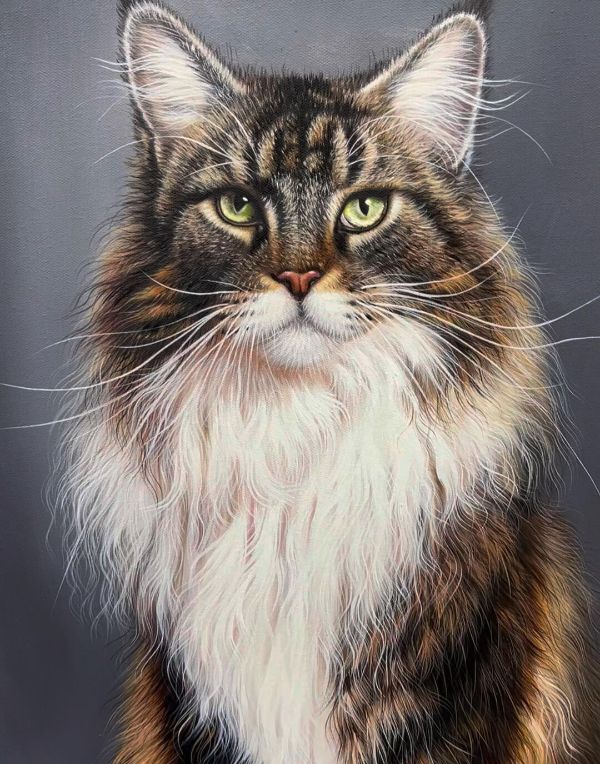 Mia the black Labrador proudly sitting with her framed birthday portrait and owner